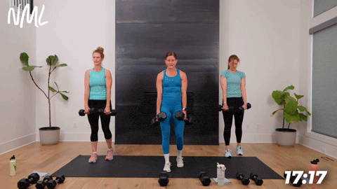three women performing dumbbell staggered deadlifts in a strength building workout