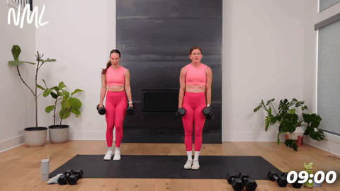 tow women performing lateral lunges in a full body strength and conditioning workout