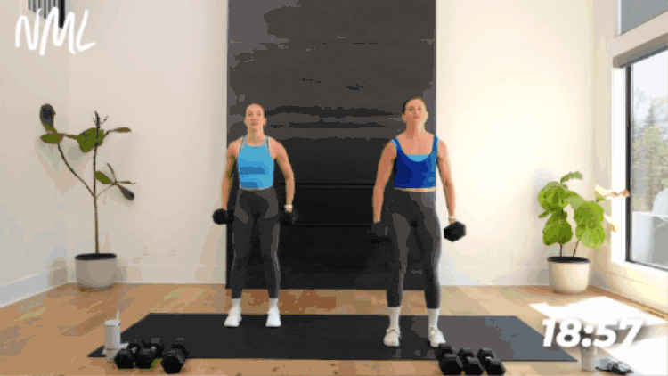 demonstration of bicep curl as part of dumbbell arm workout