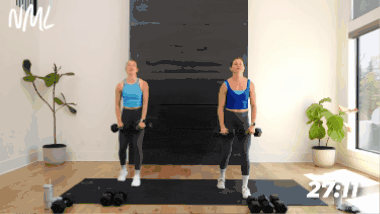 women demonstrating lateral raise exercise as part of dumbbell arm workout