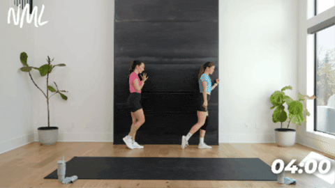 women performing standing hip rotations