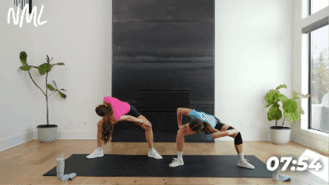 women performing wide squats as part of active recovery flow
