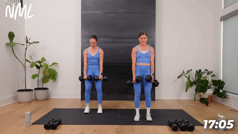 two women performing dumbbell deadlifts in a 20 minute workout at home