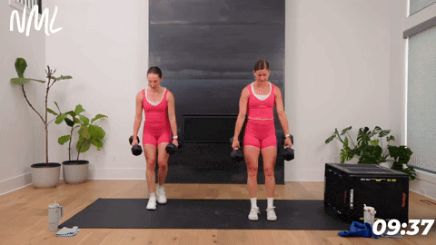 two women demonstrating how to perform curtsy lunges with dumbbells in an at home glute workout