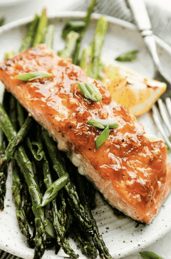 Honey Glazed Salmon with roasted asparagus and lemon slices. 