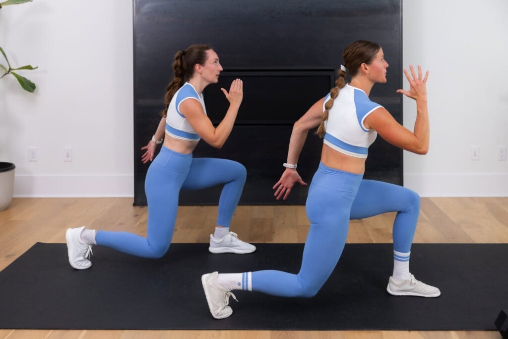 women performing a lunge jump as part of 30 minute hiit workout at home