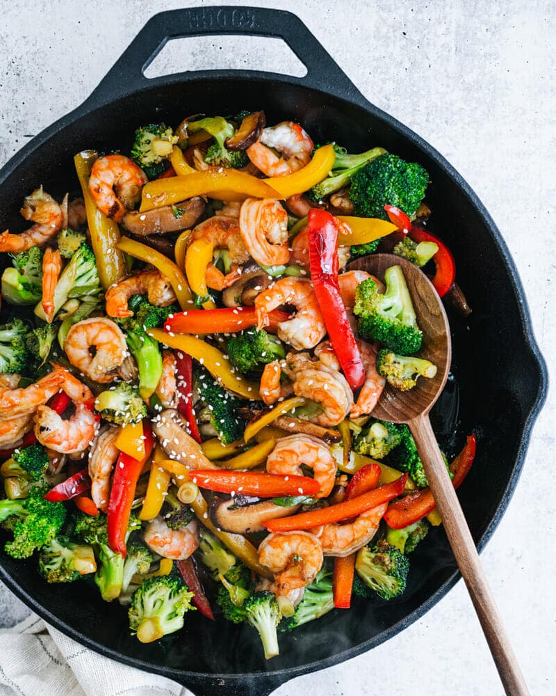 Shrimp Stir Fry with broccoli, red peppers, yellow peppers and sesame seeds. 