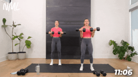 women performing a standard bicep curl with weights