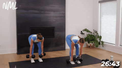women performing a deadlift with dumbbells as part of full body hiit with weights