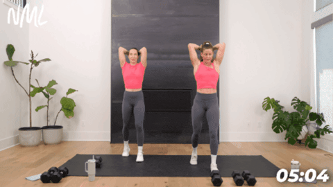 2 women performing overhead tricep extensions with dumbbells