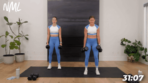 two women performing a squat with calf raise as part of hiit workout