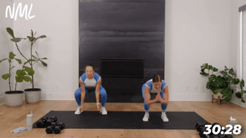 women performing squat jumps as part of 30 minute hiit workout