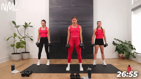 three women demonstrating how to perform a dumbbell squat in an at home circuit workout