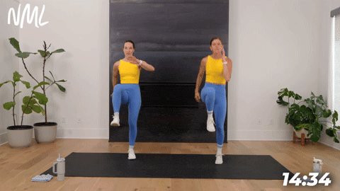two women demonstrating high knee skips in a bodyweight cardio workout