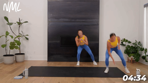 two women demonstrating lateral shuffles in a bodyweight cardio workout