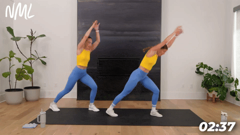 two women demonstrating knee slams in a bodyweight cardio workout