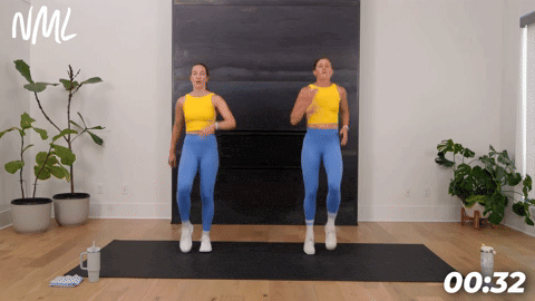 two women demonstrating high knee sprints in a bodyweight cardio workout