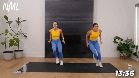 two women demonstrating lateral bounds in a bodyweight cardio workout
