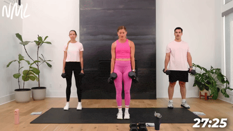 three people performing reverse lunges in a full body dumbbell workout