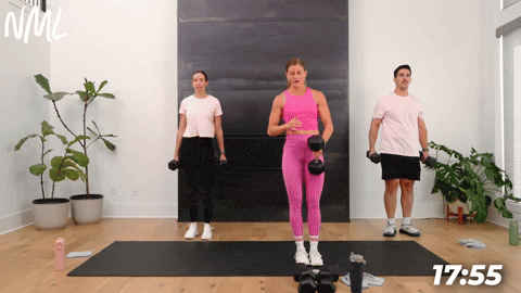 three people performing lateral lunges in a full body dumbbell workout