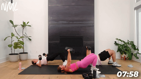 three people performing a chest press glute bridge in a full body dumbbell workout