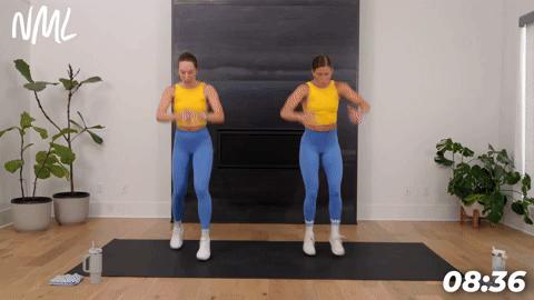 two women demonstrating ski runs in a bodyweight cardio workout