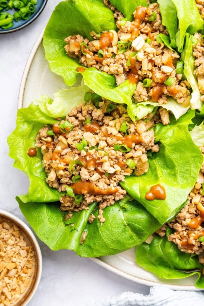 Asian Chicken Lettuce Wraps with ground turkey, butter lettuce, homemade sauce and green onions.