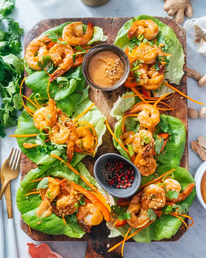 Shrimp Lettuce Wraps on butter lettuce with shredded carrots and homemade sauces.
