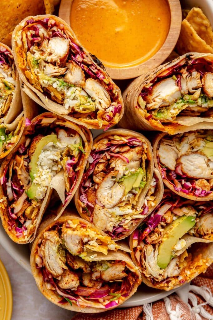 Southwest Chicken Wraps with grilled chicken, red cabbage, avocado, rice and homemade southwest sauce.