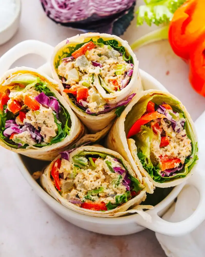 Tuna Wraps with lettuce, tuna, red peppers, red cabbage and onions.