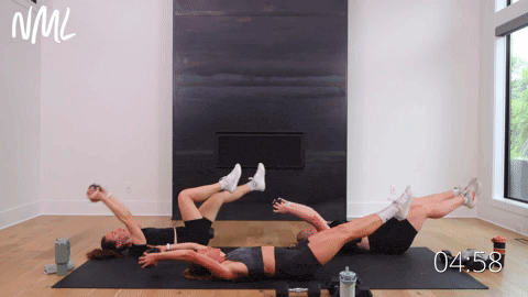 One women performing weighted deadbugs. Two women performing Dumbbell Overhead Pull and Crunch.