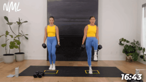 women demonstrating a lunge with three pulses as part of a strength cardio workout