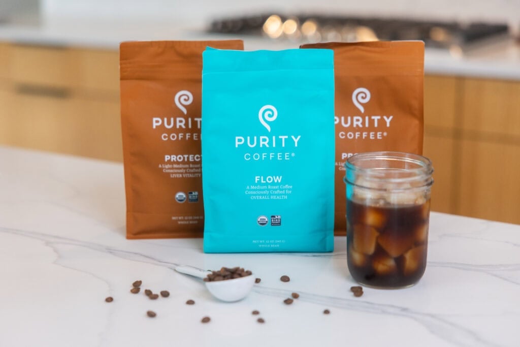 three bags of coffee beans on white counter