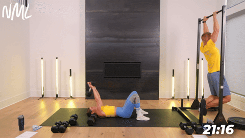 one person performing pull ups and one person performing dumbbell pullovers in an athletic back and leg workout