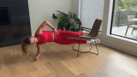 woman demonstrating copenhagen planks as part of the best adductor exercises