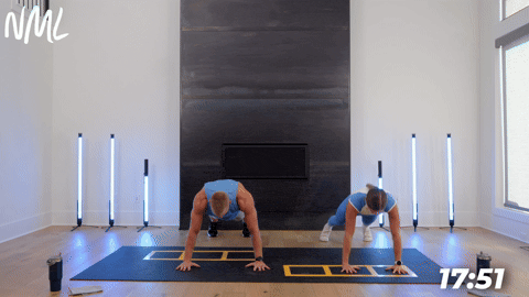 two people demonstrating a push up to t and lateral walk in a cardio and core workout