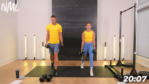 two people performing a dumbbell split lunge in an athletic back and leg workout