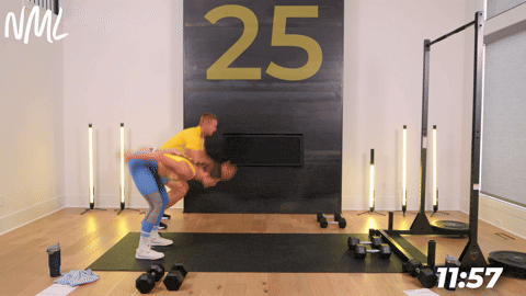 two people performing a broad jump cardio exercise in an athletic back and leg workout