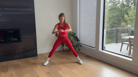 woman demonstrating lateral squats as part of the best adductor exercises