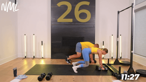 two people performing a dumbbell beast back row in an athletic back and leg workout