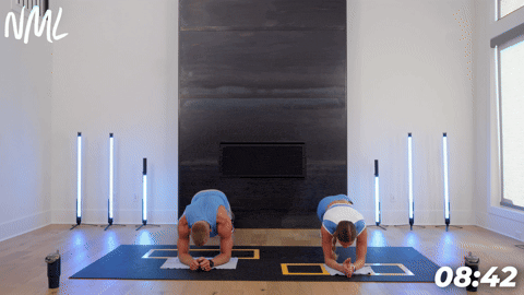 two people demonstrating a plank star tap in a cardio and core workout