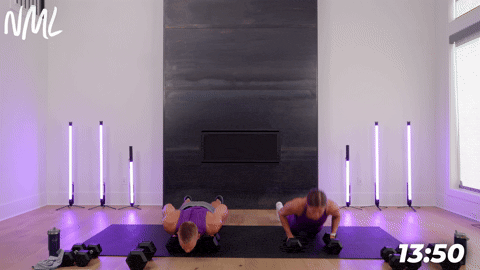 male and female performing dumbbell burpees.