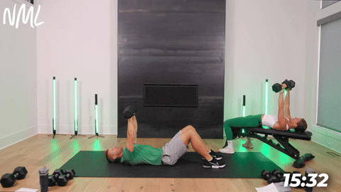 A male performing a chest press from the floor and a female performing chest press laying on a bench. 
