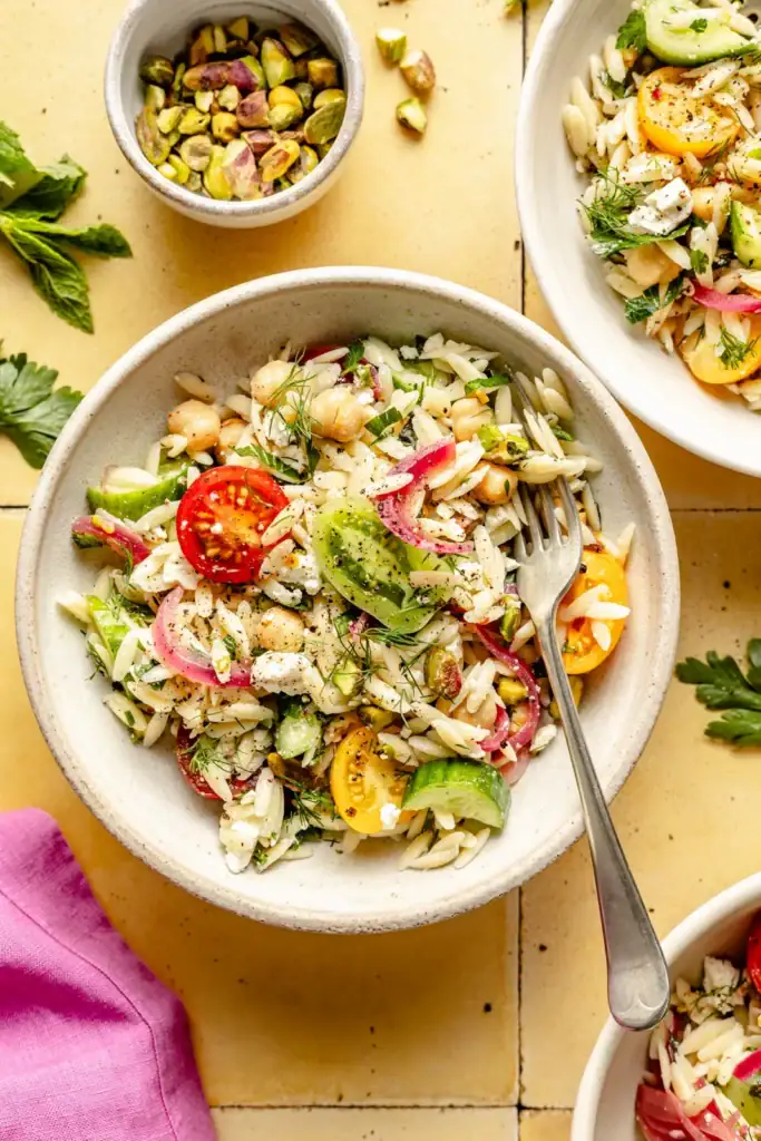 Chickpea Feta Pasta Salad feta, pistachios, pickled red onions, and tons of fresh herbs, and homemade lemon vinaigrette.