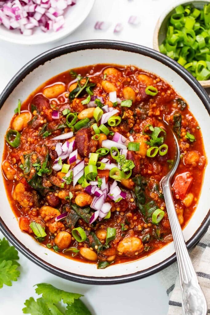 Roasted Red Pepper Quinoa Chili with ed peppers, beans, chili seasoning, and jalapeño.