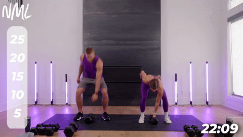 two people performing alternating dumbbell snatches.