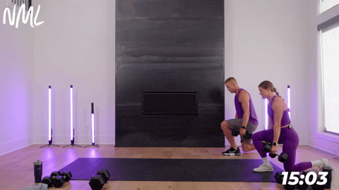 one male and one female performing walking lunges with dumbbells as part of a full body dumbbell only workout.