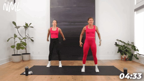 women in front of fire place performing bodyweight squats as part of 5 minute workout