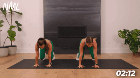 women performing a bear crawl exercise as part of 10 minute ab workout