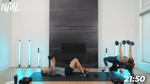 woman and man performing chest presses as part of leg and chest workout